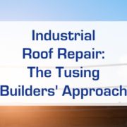 The shadow of two men on a roof behind text that reads "Industrial Roof Repair: The Tusing Builder's Approach.