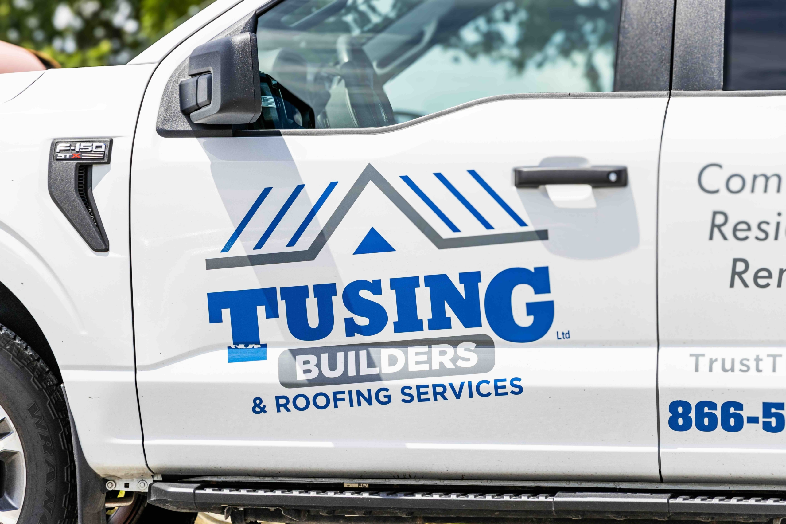 Tusing Builders & Roofing Services company truck, representing their mobile fleet of technicians providing high-performance commercial roofing in Akron, OH, and surrounding Northeast Ohio regions.